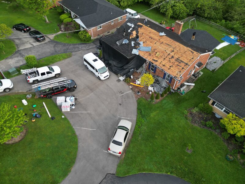 NBD crew actively working on roof tear-off in residential neighborhood