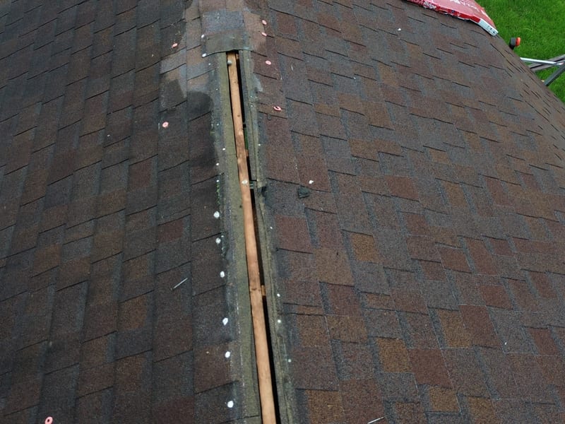 Tight aerial straight down the ridge with the old aluminum vent removed and the ridge opened up