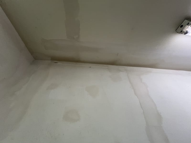 Freshly re-mudded ceiling and wall joint, patched and feathered smooth ahead of paint