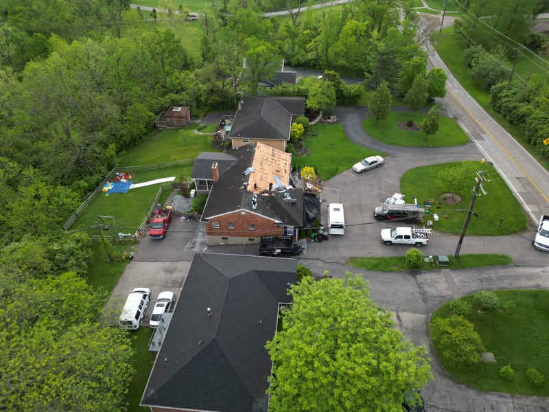 Overview of the whole property and cul-de-sac with the ridge torn off to bare decking