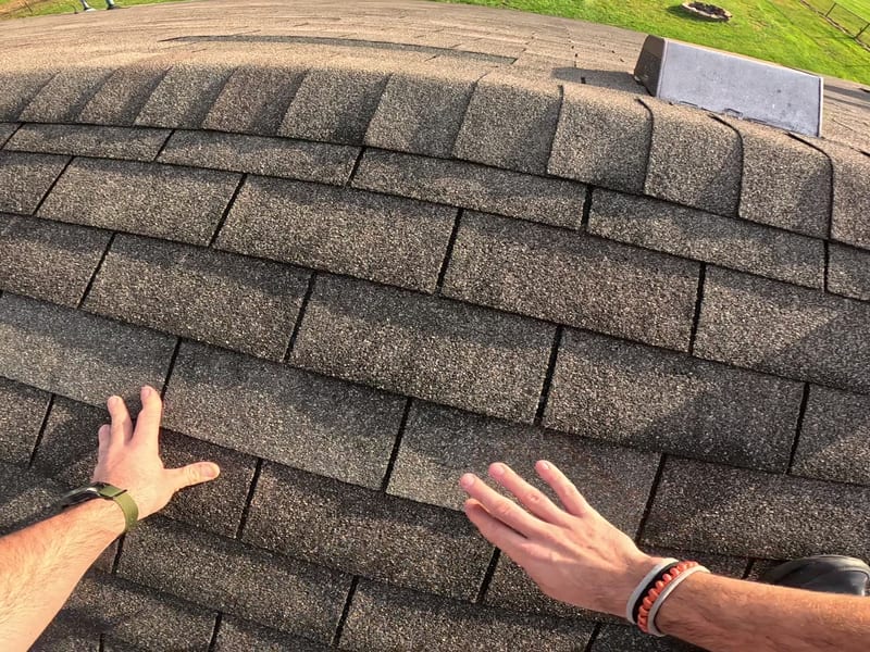 Tight detail of the shingle field where new and existing shingles meet