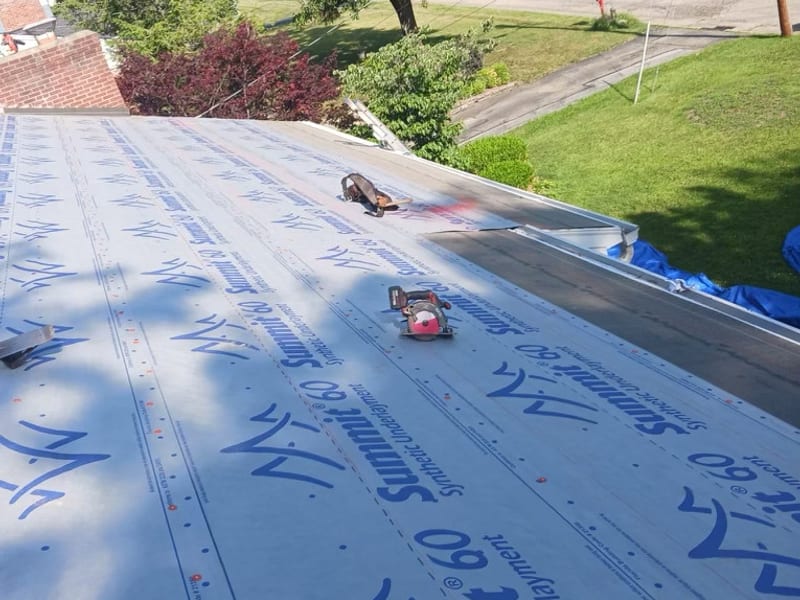 The deck stripped and dried in with synthetic underlayment run out over the full slope and new drip edge on