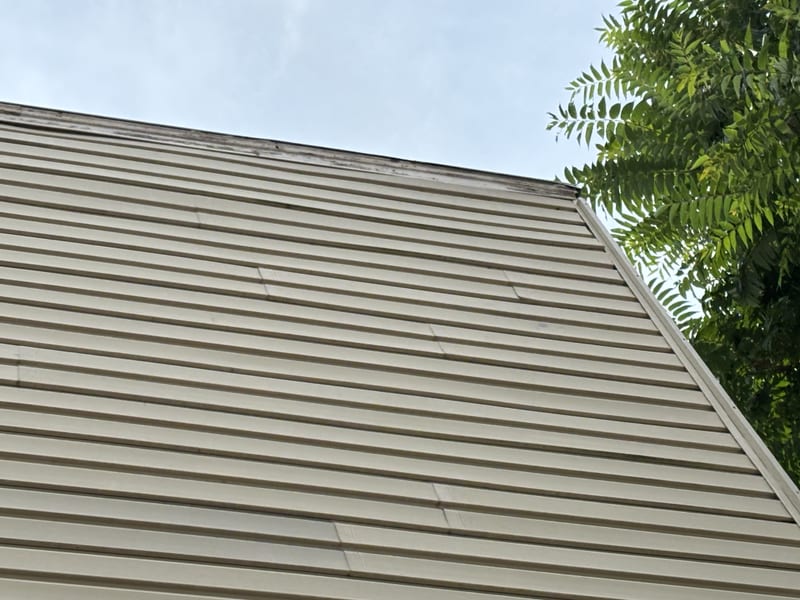 Close view of the head of the wall with the top course back in and seated tight under the trim board